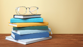 Stack of books for homework help.