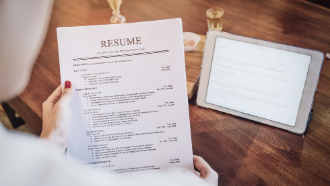 Person editing resume at Career Center
